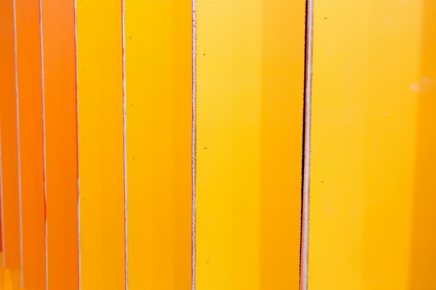 Vertical panels create a gradient from orange to yellow.